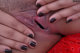 A close up of a woman's hands on a man's penis.